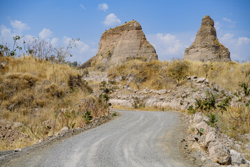 Gravel road in Mexico. Dry climate with big, distinctive rock formations