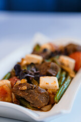 Stewed meat with vegetables and mushrooms