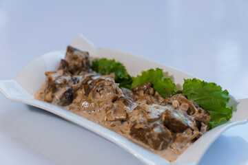 Stewed meat with vegetables and mushrooms