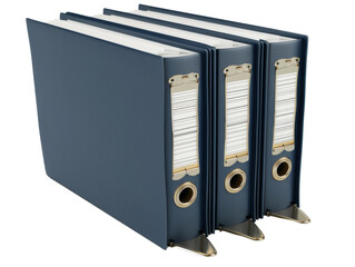 Three blue binders stacked on a shelf.  The binders are closed and have metal rings.