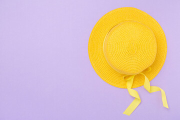 Yellow hat on color background, top view. Summer concept