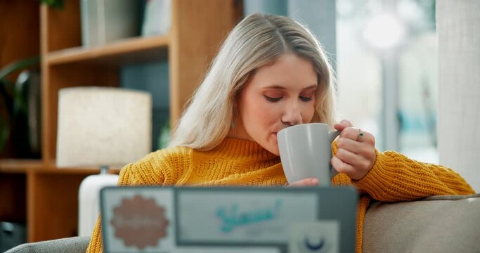 Woman, relax and laptop with coffee on sofa for morning, online browsing or checking email at home. Young female person with warm beverage, drink or tea on computer for communication in living room