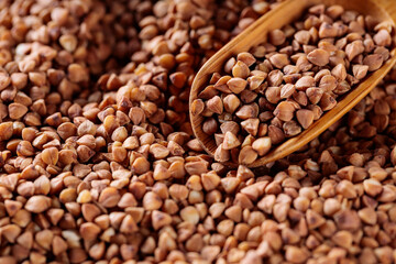 Buckwheat Grains in Wooden Scoop