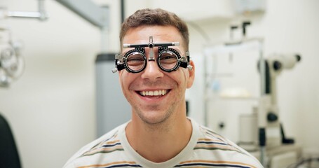 Portrait, happy man and trial frame for eye care, vision and healthcare in clinic. Face, smile and patient with test lens or tool for wellness, ophthalmology or optometry for eyesight correction exam