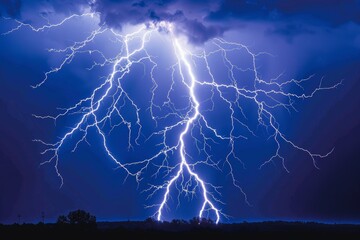 Intense night lightning storm over countryside landscape