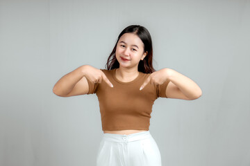 An excited young woman presenting and showing isolated photocopy space