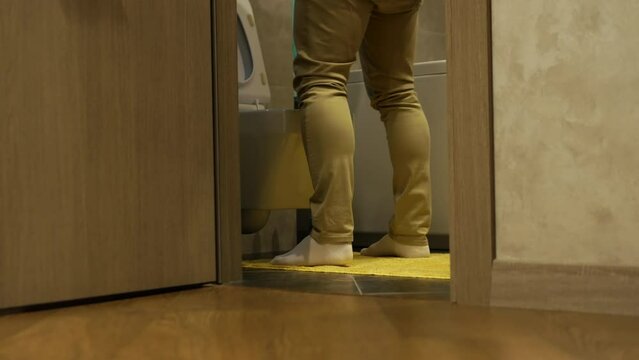 Prostate adenoma in humans. Urinary tract disease. Man near the toilet in pain. A man has problems with the genitourinary system, runs to the toilet