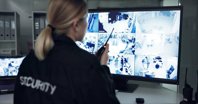 Woman, radio and security guard speaking by cctv monitor for protection, building safety or data center. Inspection, video surveillance agency and control room with footage, computer and back view