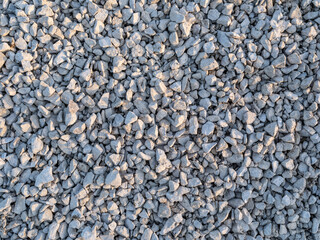 White gravel texture on sunny day