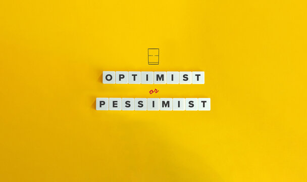 Optimist or Pessimist Banner. Mindset Approach and Personality Type. Glass of Water as Half full or as Half Empty. Text on Block Letter Tiles on Yellow Background. Minimalist Aesthetics.