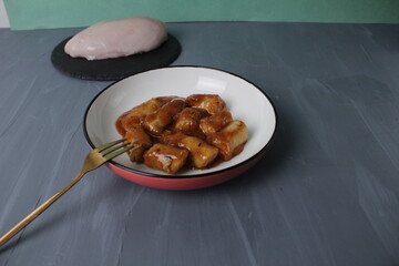Mini chicken sausages chicken fillet and chicken breast on a gray background. Chicken Cooking Concept