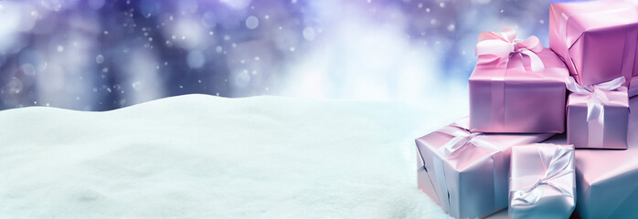 Winter background, Christmas tree and presents on a snow background