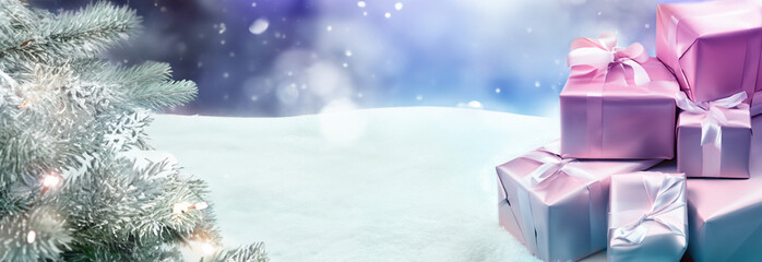 Winter background, Christmas tree and presents on a snow background