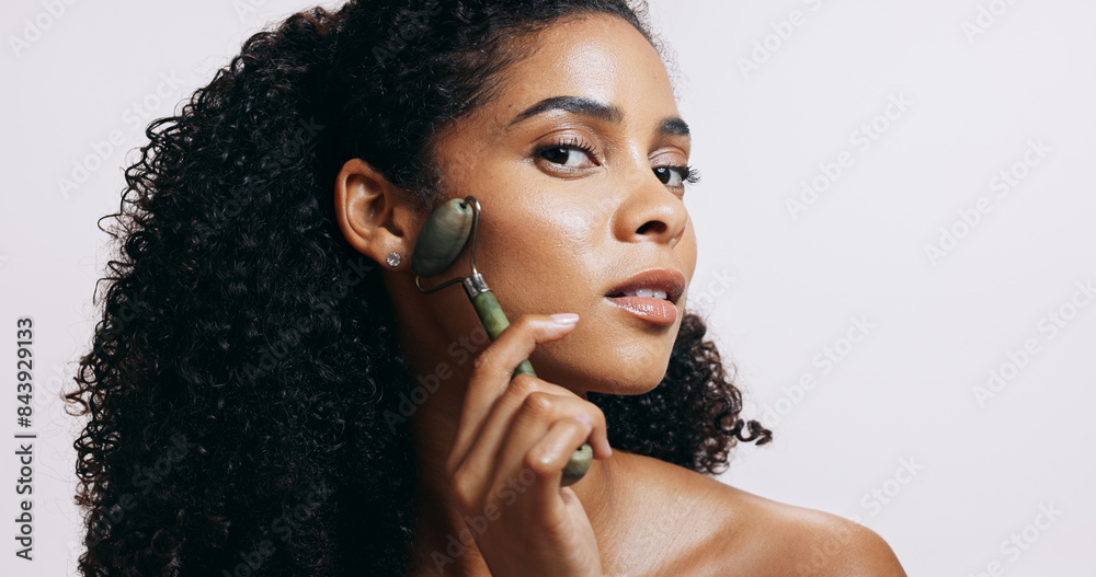 Sticker Face roller, shine and woman with cosmetics, massage and makeup on grey studio background. Portrait, person and model with tool, wellness and grooming routine with skincare, dermatology and glowing