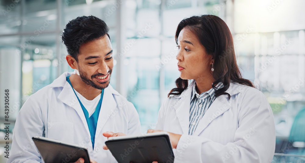 Poster Asian doctors, man and woman with tablet, smile or check results for medical services at hospital. People, happy and digital touchscreen in clinical study, review and feedback at clinic in Indonesia