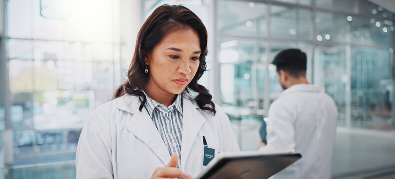 Hospital, doctor or woman with tablet, healthcare or internet with research for cure, online reading or medical news. Professional, employee or physician with tech, digital app for schedule or result