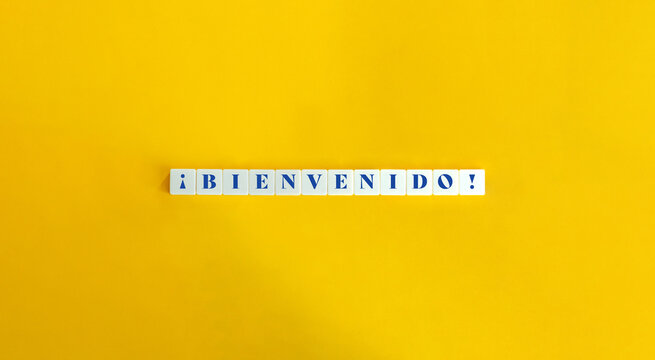 Bienvenido (Welcome) in Spanish Banner. Text on Block Letter Tiles on Yellow Background. Minimal Aesthetics.