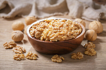 bowl of walnuts on wooden table