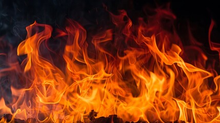 Texture of fire flames on black background. Burning red hot sparks