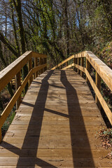 The river hiking trail Ecovia do Vez near Arcos de Valdevez, Portugal. Ecovia do Vez wooden pathways along the riverside.