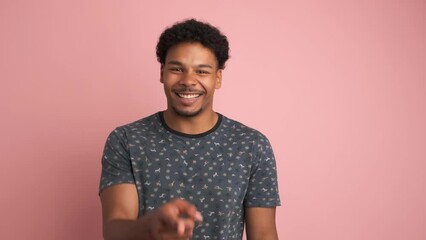 Amused man laughing loudly at funny joke while looking at camera