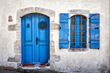 door and window of an old traditional country house on the island of Crete