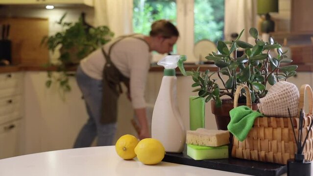 the woman in the background is mopping the kitchen floor