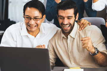 Excited and happy office worker employee celebrate after make successful strategic business...