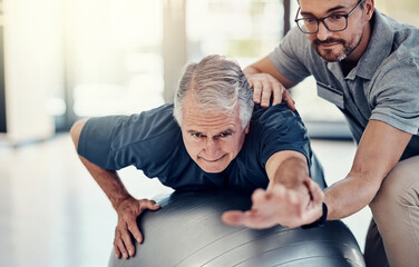Stretching, physiotherapist and old man with gym ball, clinic and medical help in senior rehabilitation. Physio, therapist and elderly patient for mobility training, exercise or support in retirement