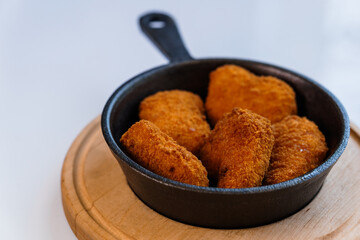 Chicken nuggets in batter on a plate