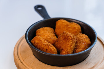 Chicken nuggets in batter on a plate