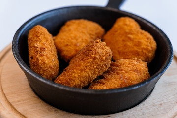 Chicken nuggets in batter on a plate