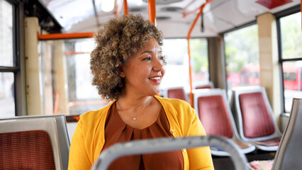 Mature woman riding in a city bus