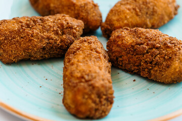 Chicken nuggets in batter on a plate