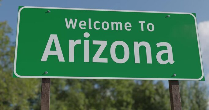 Driving By A Welcome To Arizona Green Road Sign.