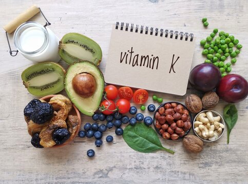 Vitamin K rich foods. High vitamin K foods. Natural dietary sources of vitamin K include dried fruit, leafy green vegetable, nuts, peas. Vitamin K helps build strong bones and regulate blood clotting.