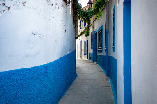 Famous Calle del Beso in the old town of Hellin, Albacete, Castilla la Mancha, Spain, with its narrow street, whitewashed houses and blue details