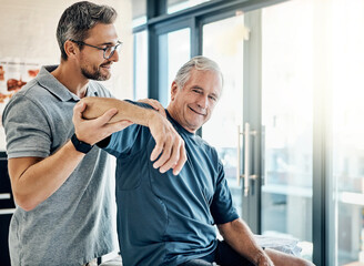 Obraz premium Healthcare, physiotherapist and old man with arm massage, stretching and help in senior rehabilitation. Physio, therapist and elderly patient for mobility training, exercise or support in retirement