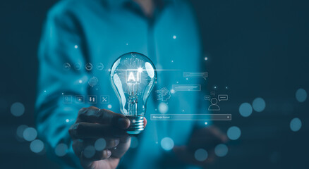 AI Artificial Intelligence Technology concept. Businessman holding a glowing lightbulb with "AI" symbol, representing artificial intelligence technology, innovation, and future digital advancements.