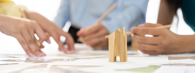 Professional architect engineer team discussion about architectural project on meeting table with...