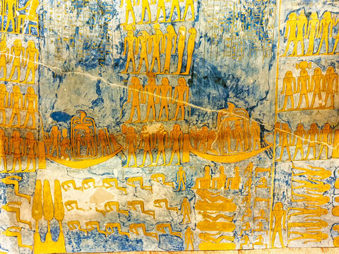 Painted relief in golden yellow color depicting the passage of the Pharoah's sould in the 3rd and 4th hour from the Book of the Night in the Tomb of Ramesses IV,KV2, in the Valley of Kings,Luxor,Egypt