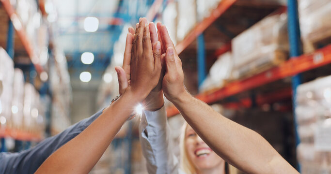 People, hands and high five in logistics warehouse together, celebration and support for winning in commercial business. Collaboration, teamwork and distribution or shipping company, goals and target - Powered by Adobe