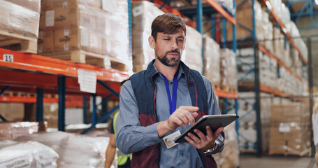 Shipping, distribution and man with tablet in warehouse for stock inspection, inventory check or...