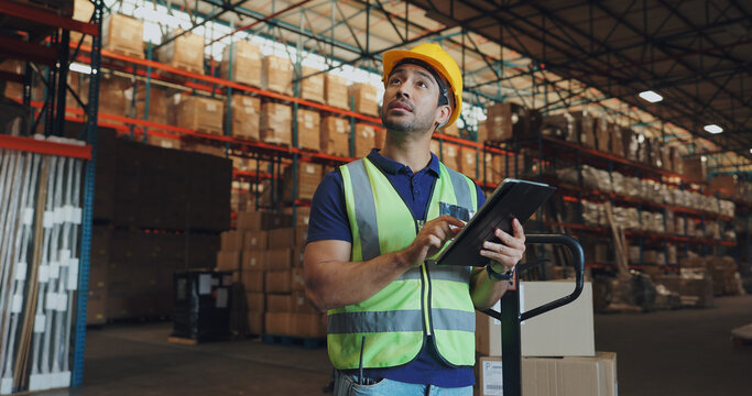 Warehouse, man and tablet in factory for logistics, orders and check inventory or stock. Male worker, digital technology and storage in shipping company for export, distribution and supply chain
