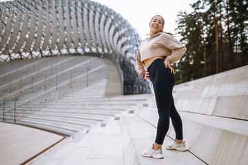 Woman, fitness and stretching in city getting ready for workout, exercise or outdoor training. People, sport, fitness and flexibility concept