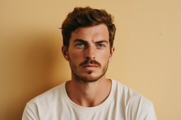Obraz premium Portrait of a handsome young man in a white T-shirt