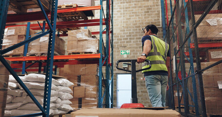 Pallet truck, man and box in warehouse with transport, safety and storage for distribution or delivery. Freight operator, logistics and stock in cardboard for shipping, cargo and inventory management © Charlize Davids/peopleimages.com