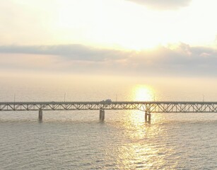 Fototapeta premium Sun setting over the Mackinac bridge