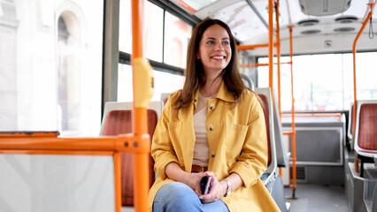 Portrait of a beautiful young woman in the bus