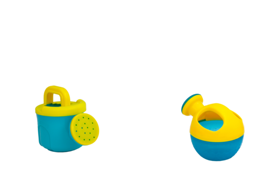 Children's toys for playing in sand. Two watering cans for sandbox without background. For text